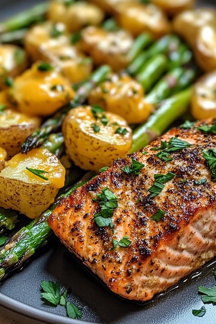 Salmon steak with asparagus and assorted vegetables