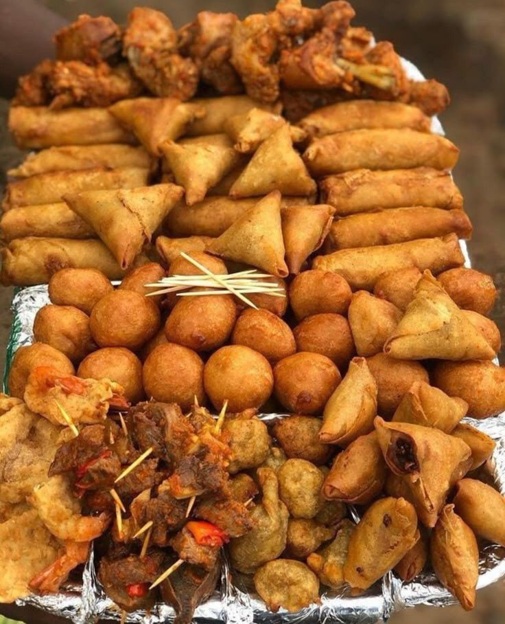 Small chops (spring rolls, samosa, beef kebab, chicken drumsticks, puff puff, moneybags)