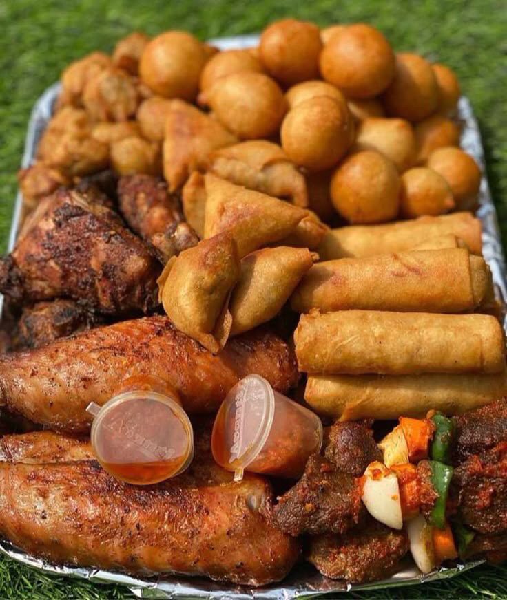 Small chops (spring rolls, samosa, beef kebab, chicken drumsticks, puff puff, moneybags)