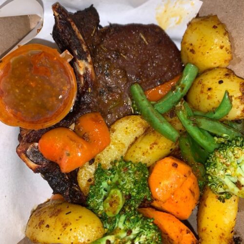 T-bone stake grilled with fresh garlic rosemary & thyme comes with potato wages and sautéed vegetables
