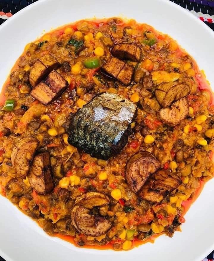 Porridge beans with fried yam or plantain with Titus fish