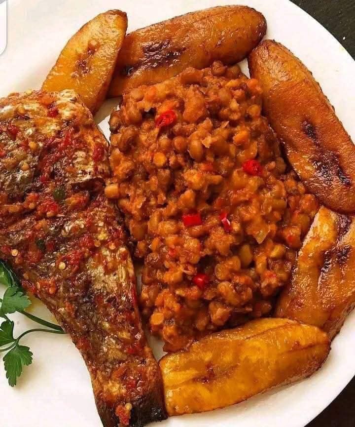 Porridge beans with fried yam or plantain with Titus fish
