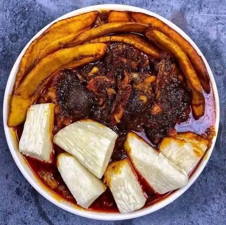 Porridge beans with fried yam or plantain with Titus fish