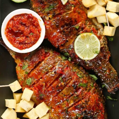 Special barbecue fish with grilled veggies and fries